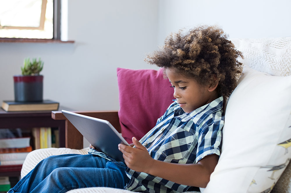Boy sitting on couch Boy sitting on couch