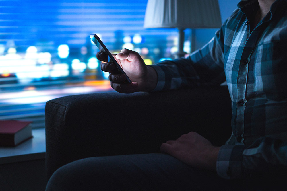 Man looking at phone Man looking at phone