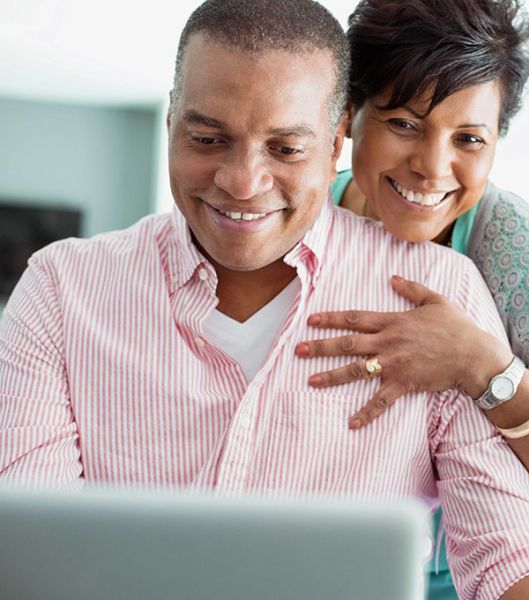 Couple Looking At Computer